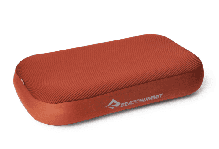 Rectangular, rust-colored Sea to Summit inflatable pillow—perfect hiking equipment for your Pacific Crest Trail adventures.