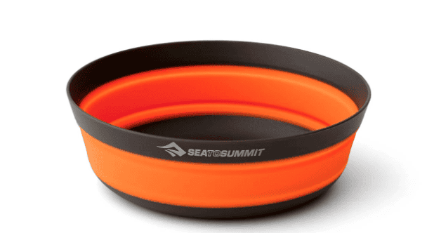Collapsible orange and black silicone bowl with Sea to Summit logo—perfect backpacking gear for hiking the Pacific Crest Trail, shown extended.