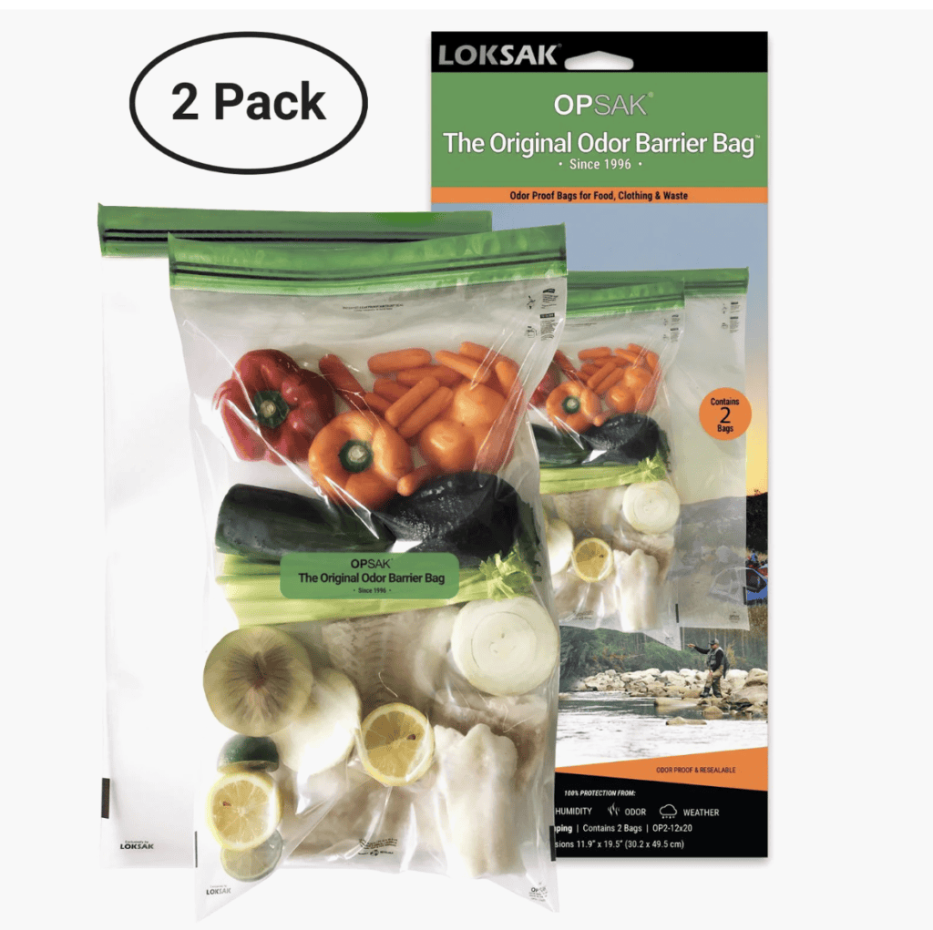 Two clear OPSAK odor barrier bags with assorted veggies and fish, ideal for Backpacking Gear on the Pacific Crest Trail, shown in packaging.