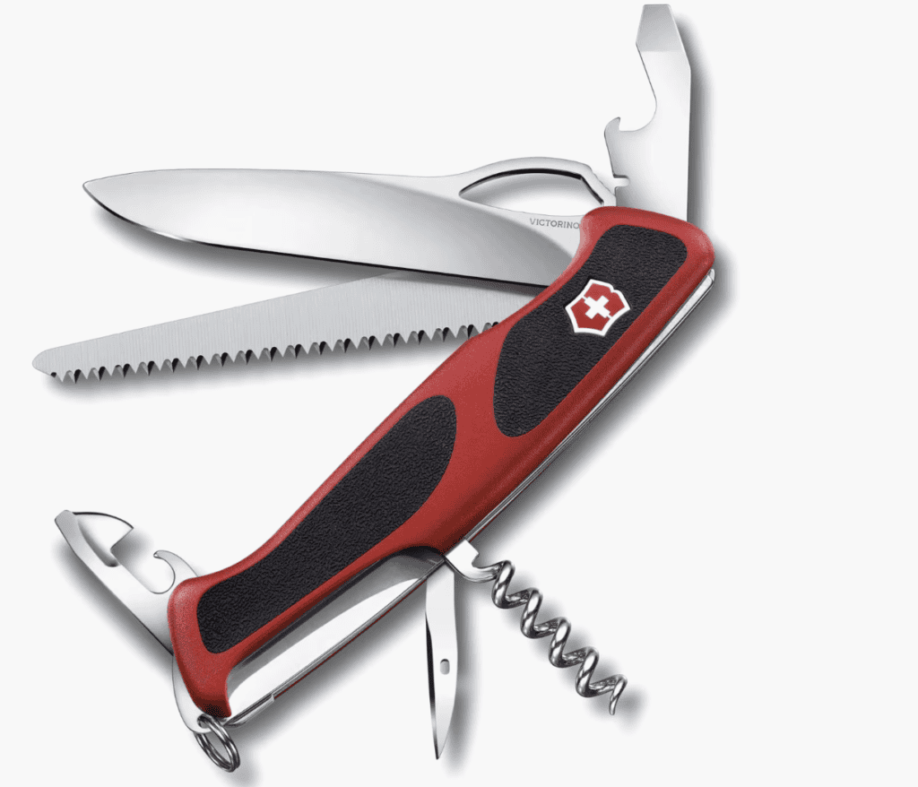 A red and black Swiss army knife with several tools extended—essential backpacking gear for hiking the Pacific Crest Trail.