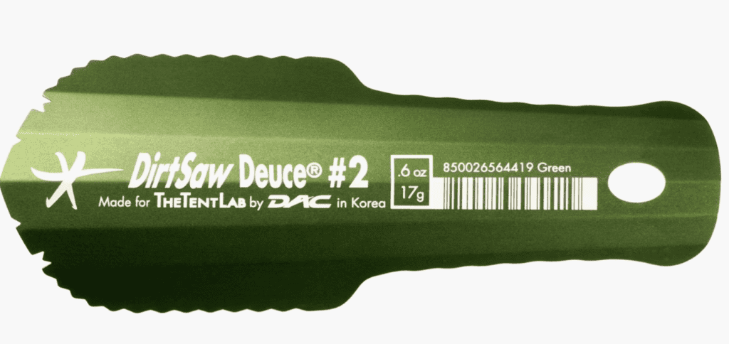 Green aluminum trowel labeled DirtSaw Deuce #2—essential backpacking gear for the Pacific Crest Trail, with weight and branding on handle.