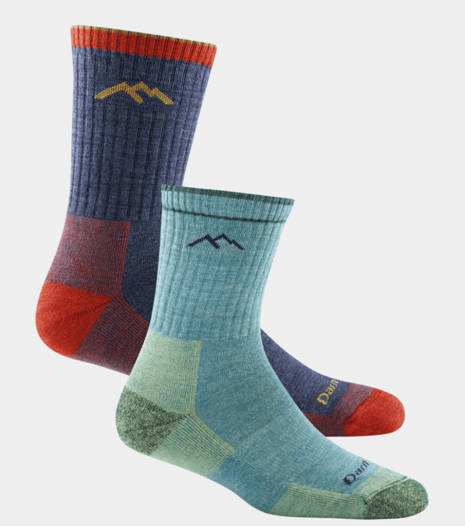 Two pairs of hiking socks, perfect for backpacking gear, in vibrant colors with a small mountain logo near the cuff.