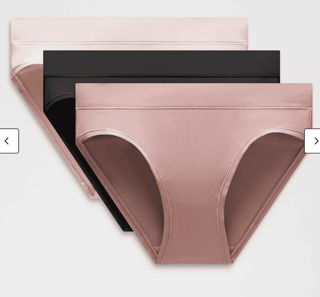Three pairs of women's seamless underwear—perfect for PCT backpacking gear—stacked in peach, black, and mauve against a plain background.