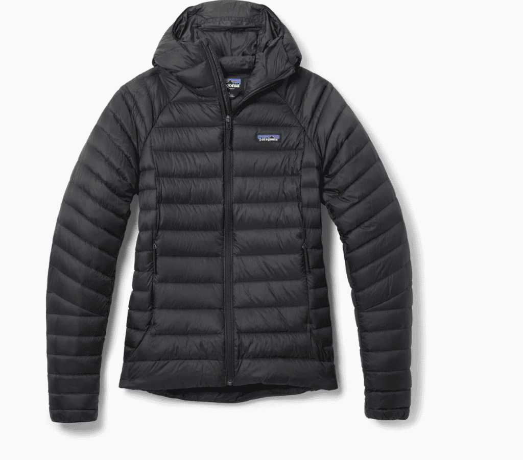 Black, hooded, quilted puffer jacket with front zipper—ideal backpacking gear for braving the cold on the Pacific Crest Trail.