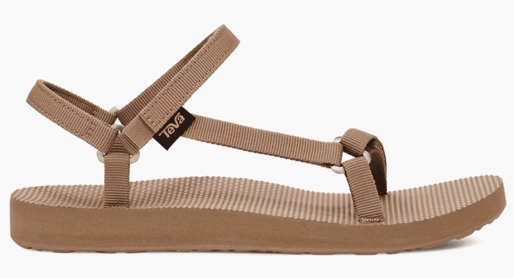 A tan Teva sandal with a flat sole and textured footbed is shown—ideal hiking or backpacking gear for the Pacific Crest Trail.